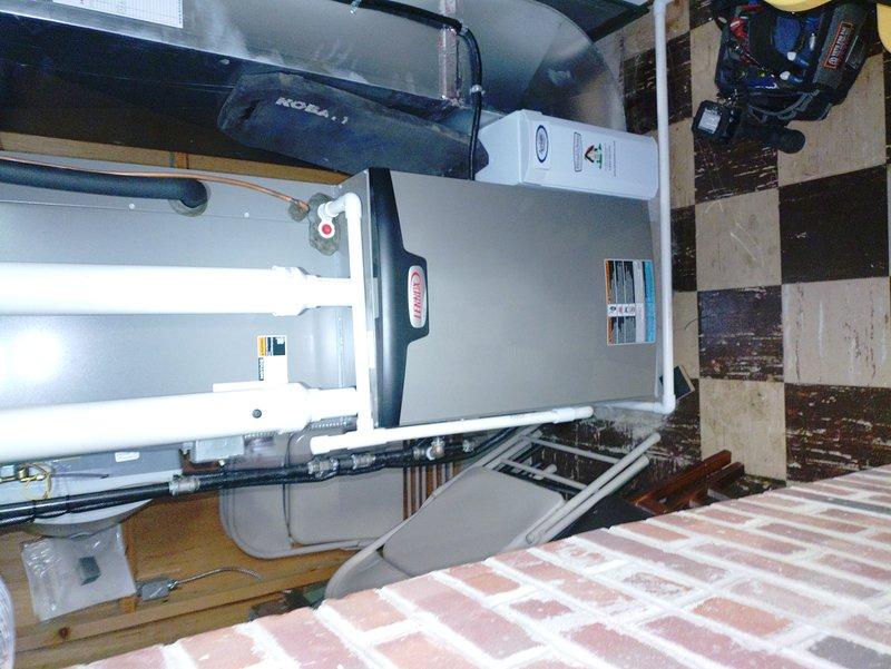 Completed scheduled MVP heating maintenance visit at 8am. Performed comprehensive inspection of attic-mounted air handler unit, examining all accessible components including electrical connections, refrigerant lines, and ductwork attachments. Verified proper operation of unit, checked wiring integrity with red, white, yellow, and green conductors visible and secure. Inspected PVC condensate drainage and copper refrigerant line connections for any signs of wear or leakage. Evaluated flexible duct connections and mounting framework for stability. All systems found operating within normal parameters. Unit labels and safety warnings confirmed present and legible. Documentation photographs captured for service records.
