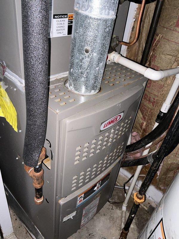 Conducted estimate for furnace replacement due to water damage originating from upstairs unit. Inspected existing Lennox furnace system and associated ductwork, noting compromised components from water intrusion. Documented current HVAC installation including furnace unit, supply and return ductwork, condensate drainage system, and copper refrigerant lines. Evaluated water heater and related plumbing infrastructure in mechanical room to assess extent of damage. Provided comprehensive replacement estimate with loss, rent, and displacement considerations for complete system restoration.