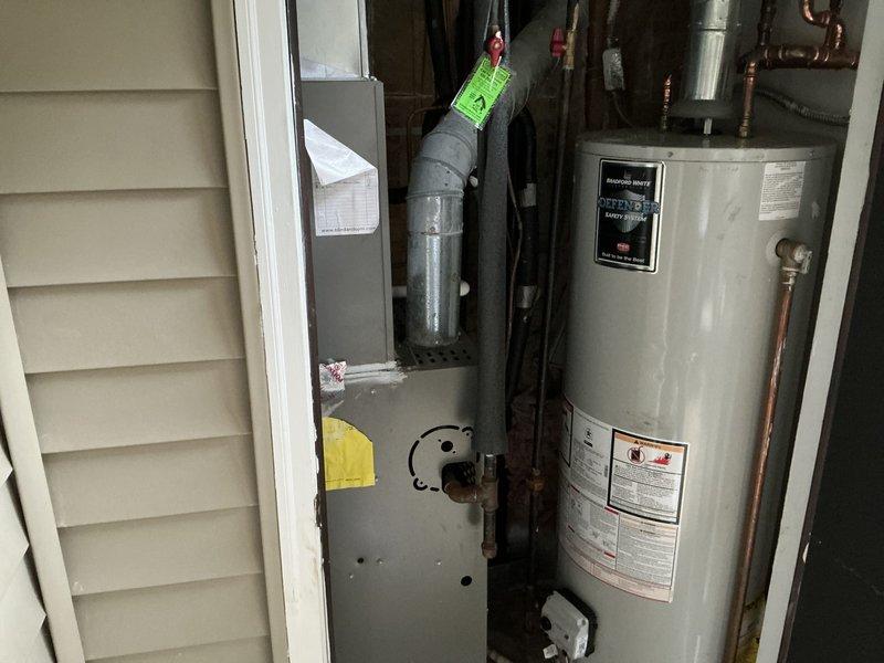 Conducted estimate for furnace replacement due to water damage originating from upstairs unit. Inspected existing Lennox furnace system and associated ductwork, noting compromised components from water intrusion. Documented current HVAC installation including furnace unit, supply and return ductwork, condensate drainage system, and copper refrigerant lines. Evaluated water heater and related plumbing infrastructure in mechanical room to assess extent of damage. Provided comprehensive replacement estimate with loss, rent, and displacement considerations for complete system restoration.