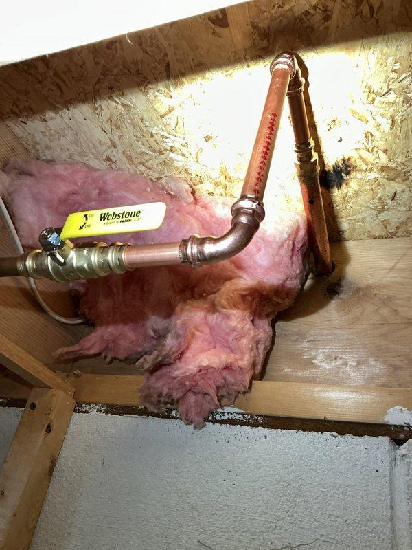 Replaced two 30-year-old exterior hose bibs with new Woodford frost-free sillcocks, including installation of Webstone shut-off valves, copper pipe connections, and necessary fittings. One fixture was located in the garage area with copper piping routed through the attic space with proper insulation clearance, and the second was installed at the front corner of the house above the brick foundation through the vinyl siding. All connections were secured and tested for proper operation and leak-free performance.