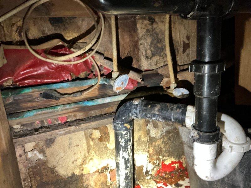 Responded to service call for kitchen sink valve shutoff. Upon arrival, accessed under-sink plumbing area and located water supply lines serving double-basin stainless steel sink fixture. Successfully shut off supply valves to isolate water flow to kitchen sink as requested, completing valve closure operation per customer requirements.