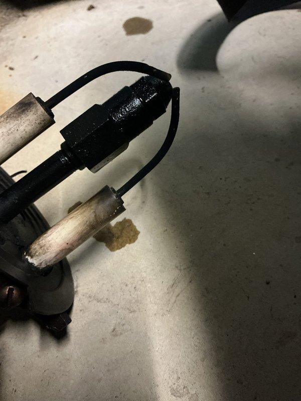 Responded to no-heat call on oil furnace with pilot light failure. Upon inspection, found flame sensor heavily corroded with significant mineral buildup and oxidation preventing proper flame detection. Removed and cleaned flame sensor assembly, restored proper operation, and verified pilot light ignition and main burner function.