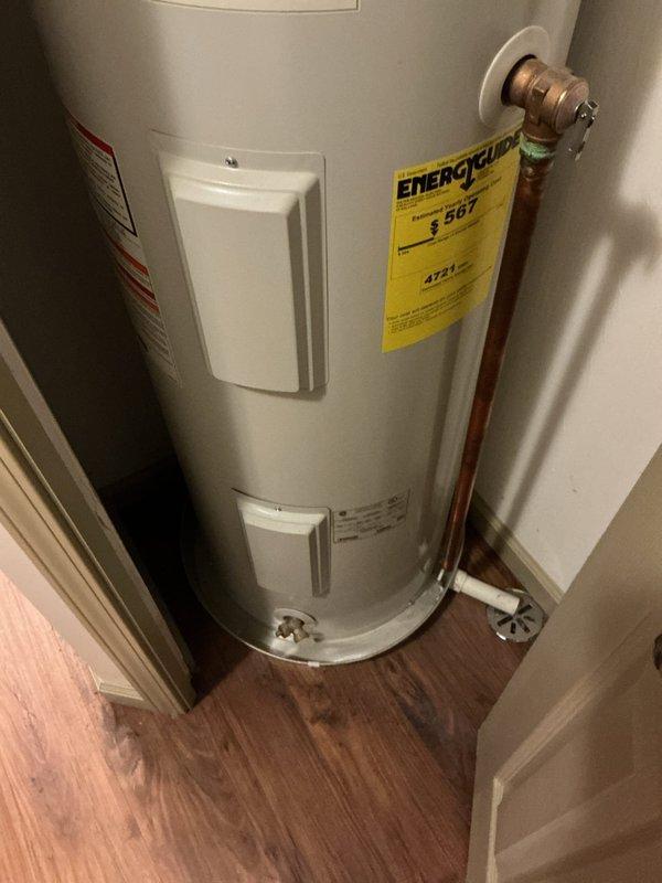Responded to service call for non-functional natural gas water heater. Upon arrival, inspected Lochinvar residential tank-type water heater installed in interior closet space. Performed diagnostic assessment of unit including visual inspection of gas supply connections, copper water supply lines with braided flex connectors, temperature and pressure relief valve, and electrical components. Verified proper venting configuration and clearances within closet installation. Documented existing conditions with photographs showing unit specifications, energy guide labeling, access panels, and plumbing connections for service records.