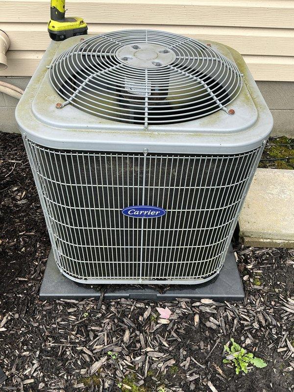 Completed BS-MVP cooling maintenance visit on aging Carrier air conditioning system. Performed comprehensive inspection of outdoor condenser unit, evaluating electrical components, capacitor condition, and wiring connections which showed signs of weathering and corrosion consistent with unit age. Renewed maintenance plan agreement during technician visit, documented equipment condition through photography, and verified system operational status for continued seasonal performance.