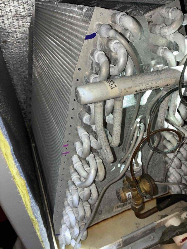 Performed routine maintenance on a 6-year-old Lennox air conditioning system. Inspected evaporator coil, refrigerant lines, and associated components; all found to be in operational condition with normal wear for age. System checked and confirmed operational.