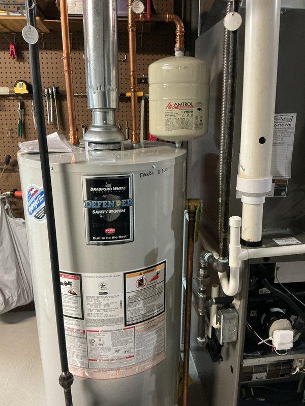 Completed MVP recurring heating maintenance visit. Performed combustion analysis on natural gas heating equipment, recording optimal readings of 14 ppm CO, 98.0% efficiency, 6.0% CO₂, and 87°F stack temperature using calibrated diagnostic equipment. Inspected Bradford White water heater with Defender Safety System, verified proper operation of connected expansion tank and plumbing components, and confirmed all mechanical systems functioning within manufacturer specifications.