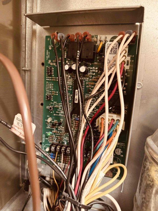 Completed recurring maintenance visit on 11-year-old heating system. Inspected electrical control panel and circuit boards, verifying proper operation of all heating controls and connections. Documented significant corrosion on metal piping and floor-mounted components requiring future attention to prevent system degradation.