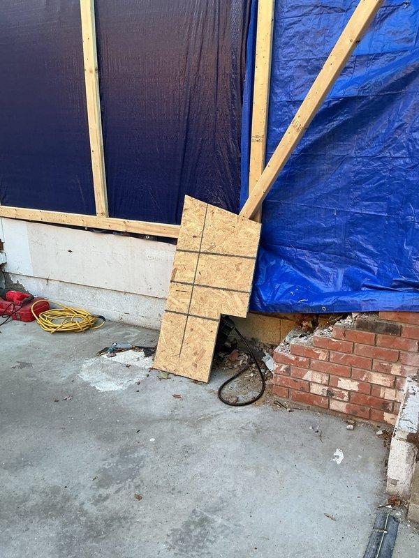 Conducted on-site plumbing assessment for residential addition project during active construction phase. Reviewed architectural blueprints indicating second floor expansion including master suite, master bathroom, walk-in closet, laundry room, and pantry. Evaluated existing plumbing infrastructure and framed wall structures to determine fixture placement requirements and supply/drain line routing for new bathroom and laundry facilities. Documented site conditions including concrete foundation, framed walls, and construction progress through photographic documentation to support detailed estimate preparation for required plumbing fixtures and rough-in installation.