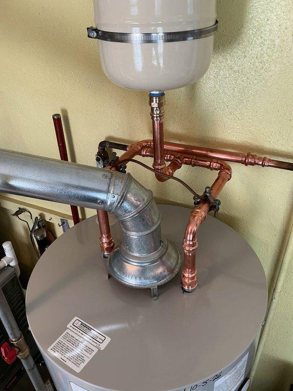 Replaced existing Rheem water heater with new Bradford White unit, including installation of code-compliant gas shut-off valve and thermal expansion tank to meet current plumbing standards. Completed all copper piping connections, installed pressure relief valve assembly, removed and hauled away old unit, and registered new tank with manufacturer for 6-year warranty coverage.