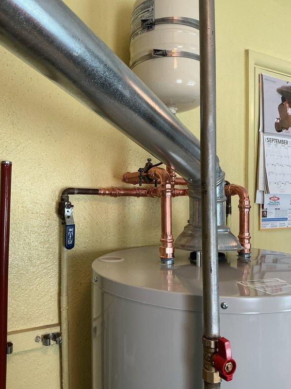 Replaced existing Rheem water heater with new Bradford White unit, including installation of code-compliant gas shut-off valve and thermal expansion tank to meet current plumbing standards. Completed all copper piping connections, installed pressure relief valve assembly, removed and hauled away old unit, and registered new tank with manufacturer for 6-year warranty coverage.