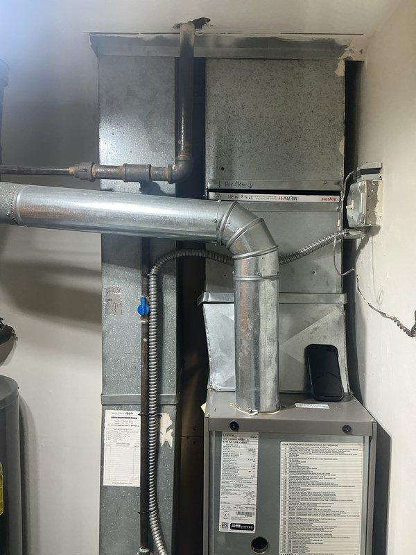 Completed routine maintenance inspection on residential heating system. Examined furnace control board including flame sense circuitry, ignitor connections, and air sense terminals to verify proper operation of safety controls and ignition components. Inspected main air handler unit, ductwork connections, and electrical disconnect to ensure system integrity and safe operation for continued heating season performance.