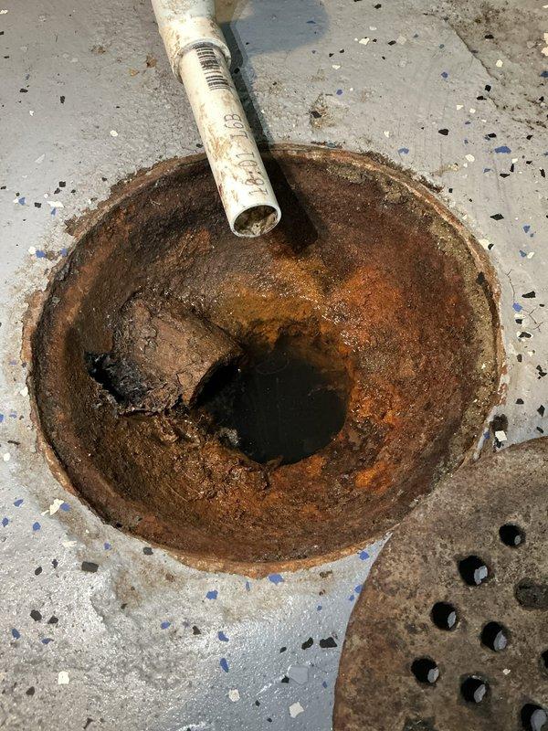 Responded to kitchen sink clog with accompanying odor. Upon arrival, inspected the P-trap assembly and drainage system beneath the kitchen sink. Removed and cleaned the heavily corroded drain components, addressing significant rust buildup and debris accumulation that was causing the blockage and foul smell. Cleared the drainage line, reassembled the P-trap system, and verified proper water flow and drainage function. System tested and restored to normal operation.