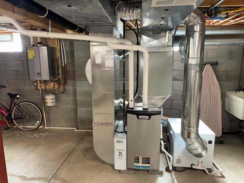 Completed comprehensive heating system maintenance inspection on gas furnace unit. Performed visual assessment of furnace cabinet, blower assembly, and ductwork connections, verifying proper installation and structural integrity. Inspected squirrel cage blower wheel for debris accumulation and operational condition, confirming adequate airflow capacity for system performance.