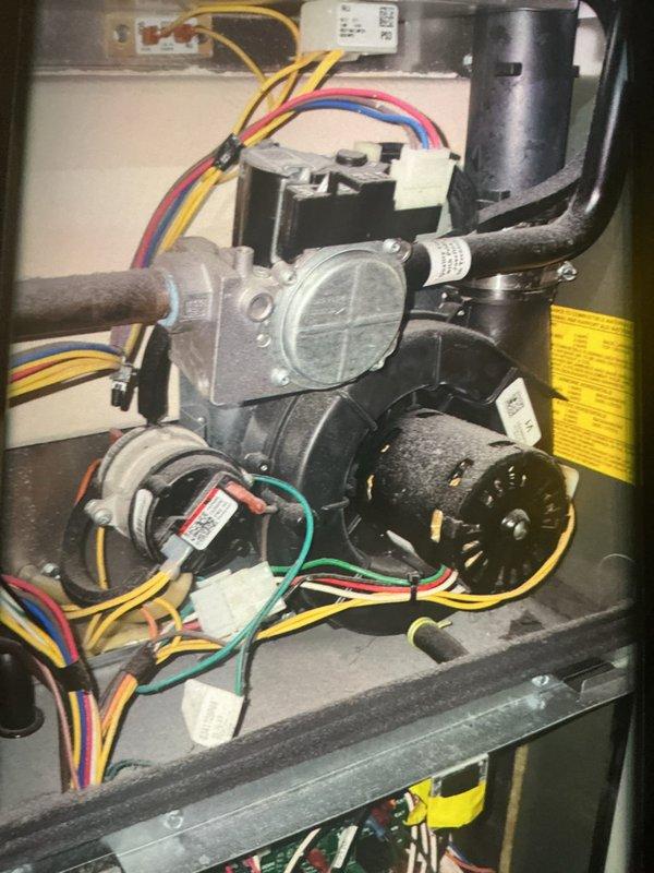 Completed MVP heating maintenance on residential HVAC system consisting of air handler and furnace unit. Performed comprehensive inspection of gas valve, blower motor assembly, electrical connections, and refrigerant lines. Verified all wiring harnesses were properly secured, checked PVC condensate drain routing, examined flexible ductwork connections, and confirmed all safety labels and warnings were legible. System tested and operating within normal parameters with no issues identified.