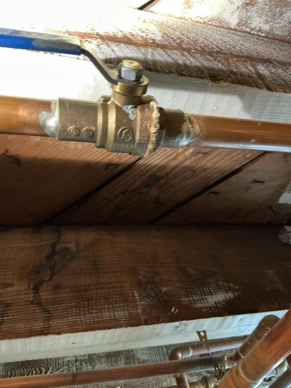 Conducted comprehensive assessment of existing tanked water heater system for replacement estimate. Inspected water supply lines, shut-off valves, and copper piping connections throughout the installation area, including crawlspace plumbing infrastructure and under-sink supply connections. Documented current plumbing configuration, valve conditions, and access points to provide accurate replacement specifications and scope of work.