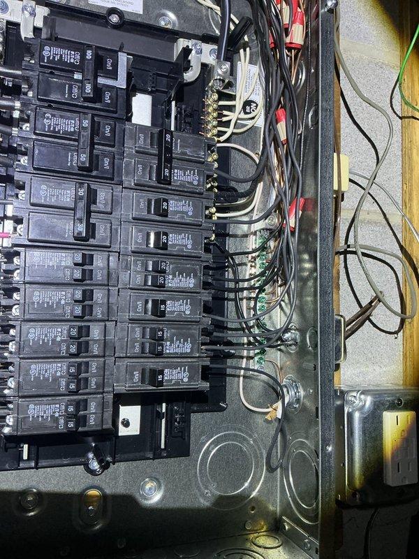 Completed 100-ampere electrical service upgrade including installation of new main distribution panel with updated circuit breaker configuration. Updated grounding system to meet 2023 National Electrical Code requirements and installed exterior disconnect switch as mandated by current code standards. Installed whole home surge protection device to safeguard electrical system and connected appliances from voltage spikes. All wiring connections properly terminated, labeled, and secured within panel enclosure with appropriate wire management.