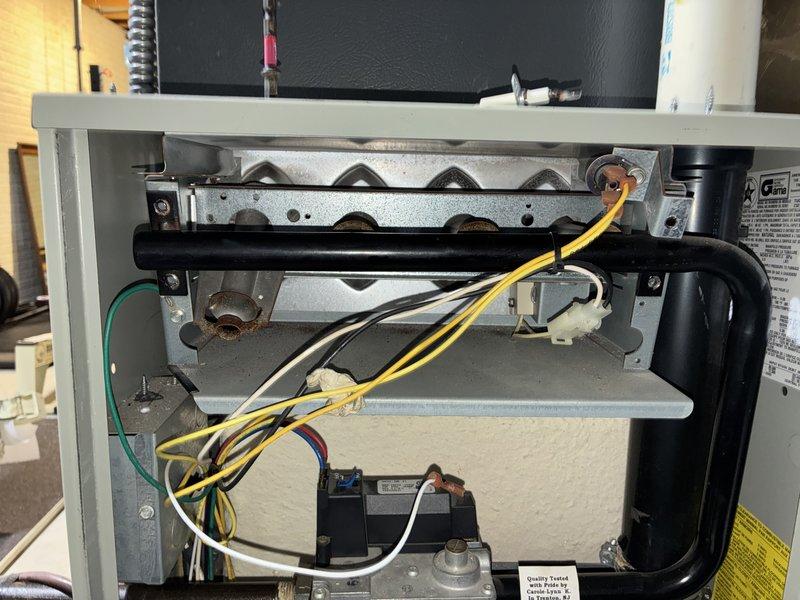 Performed comprehensive burner cleaning and blower motor wash on residential heating unit. Accessed internal components through main cabinet, removed accumulated dust and operational residue from heat exchanger and burner assembly. Extracted blower motor assembly from housing, thoroughly cleaned blower wheel blades and motor housing to restore optimal airflow efficiency. Inspected all electrical connections and wiring during service. Reassembled unit and verified proper operation upon completion.