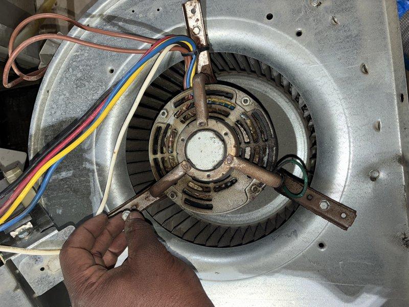 Performed comprehensive burner cleaning and blower motor wash on residential heating unit. Accessed internal components through main cabinet, removed accumulated dust and operational residue from heat exchanger and burner assembly. Extracted blower motor assembly from housing, thoroughly cleaned blower wheel blades and motor housing to restore optimal airflow efficiency. Inspected all electrical connections and wiring during service. Reassembled unit and verified proper operation upon completion.