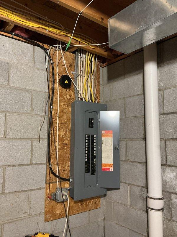 Troubleshot and repaired a non-functional electrical outlet on the front porch by identifying the source of power loss and restoring proper electrical supply. Installed a new dedicated 240-volt circuit in the basement with an approximately 8.5-foot conduit run through the open ceiling area, terminating at a receptacle mounted to the concrete block wall in the same room as the main electrical panel. All work was completed to code specifications with proper wire sizing, circuit protection, and secure mounting methods.