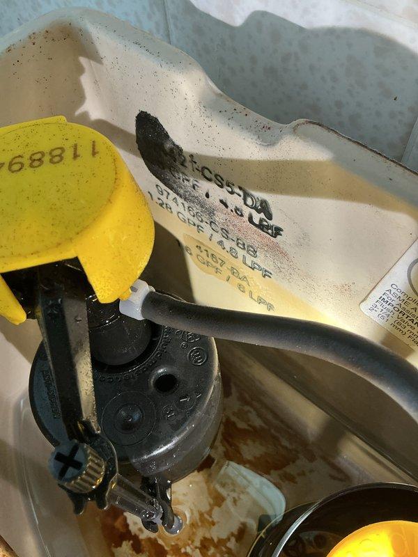 Responded to service call for toilet leaking at base. Upon inspection, identified failed wax ring and mounting hardware causing water seepage. Documented existing conditions with photos showing toilet tank components and fill valve assembly. Ordered replacement parts for return visit to complete repairs, including new wax ring and mounting bolts to properly reseal toilet base and eliminate leak.