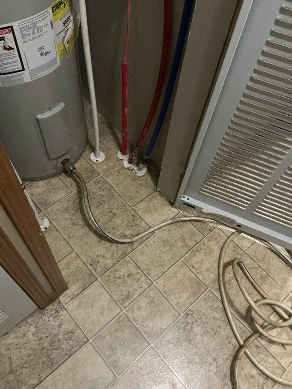 Responded to service call regarding possible rust discoloration in water supply. Performed visual inspection of tanked water heater and associated plumbing system, including PEX supply lines and whole-house water filtration unit mounted on basement wall. Examined water heater condition, checking for signs of internal tank corrosion, sediment buildup, and proper operation of anode rod. Inspected filter housing and cartridge for rust particles or sediment accumulation that could indicate source of discoloration. Evaluated condition of copper and PEX piping connections for any signs of galvanic corrosion or deterioration. Documented equipment configuration with photographs showing water heater installation with color-coded PEX supply lines and inline filtration system. No active leaks, unusual noises, or immediate safety concerns observed during inspection.