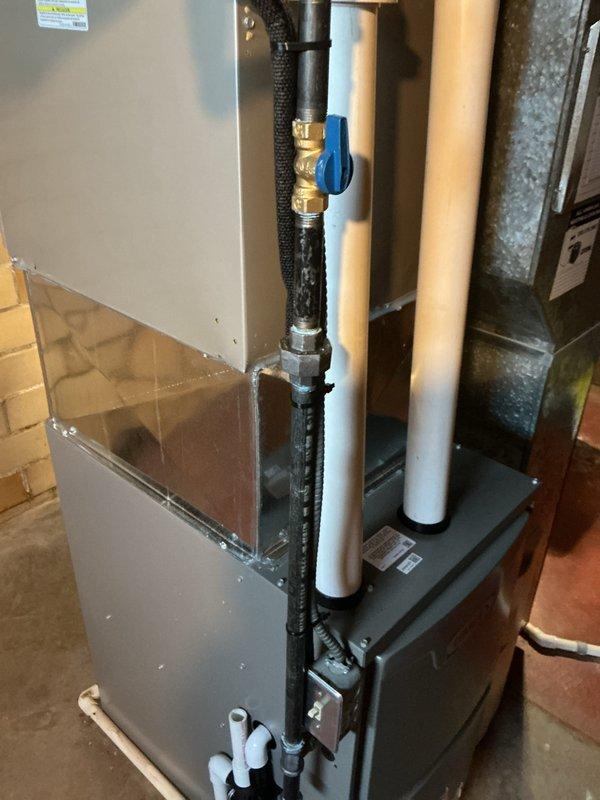 Completed installation of high-efficiency furnace system with proper venting and gas line connections. Installed and secured PVC vent piping with appropriate hangers and supports, routed condensate drain lines, and connected insulated gas supply line with brass fittings and shutoff valve. Verified all ductwork connections, tested system operation, and collected final payment to close out project.