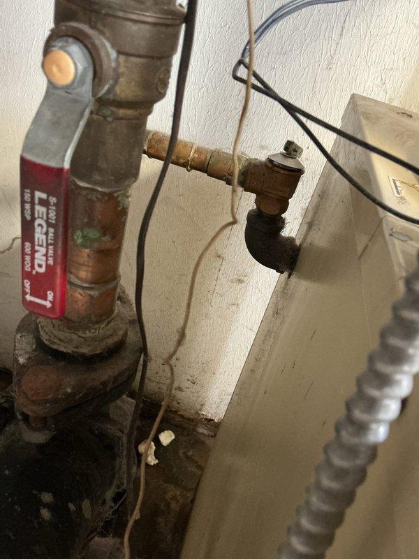Responded to water leak issue affecting multiple baseboard heating units supplied by aging 16+ year old boiler system. Upon inspection, found active leaks at several baseboard connections requiring immediate shutdown of boiler to prevent further water damage. Documented existing hydronic heating system configuration including expansion tank, circulator pump, zone valves, and copper piping network showing significant age-related corrosion and oxidation throughout. System remains offline pending customer decision on repair versus replacement options given the advanced age of equipment and extent of deterioration observed in piping components.