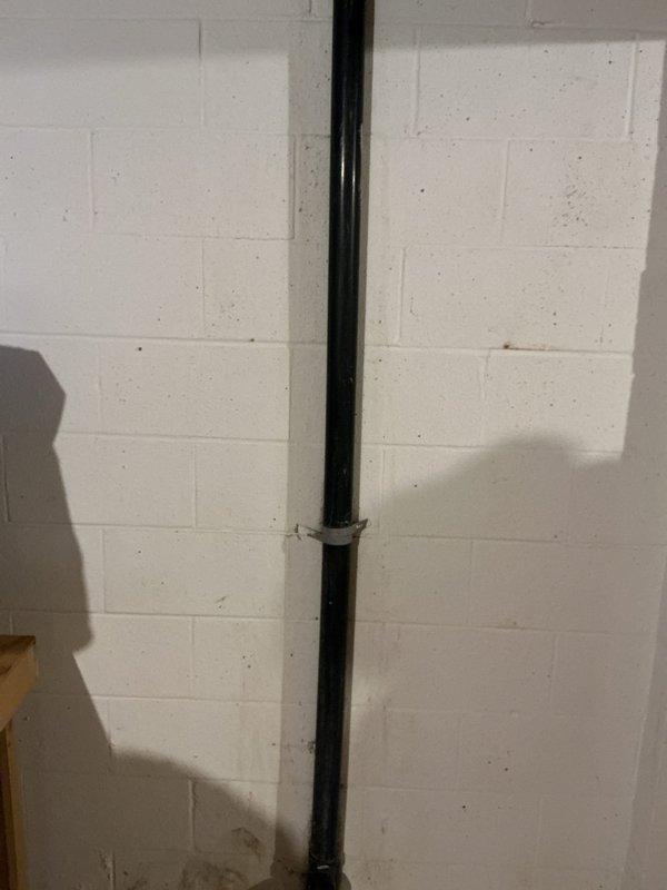 Responded to report of cracked PVC drain line beneath kitchen sink causing periodic leakage of contaminated water into basement area. Upon inspection, identified deteriorated vertical drainage pipe with visible cracking along the run. Replaced damaged section of PVC drainage pipe, ensuring proper alignment and secure mounting to wall with appropriate brackets. Tested system for leaks and verified proper drainage flow upon completion.