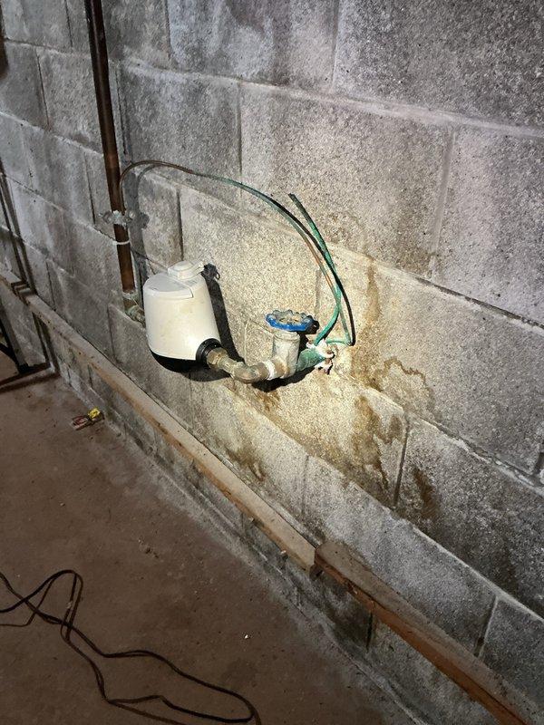 Installed two water shut-off valves for cold and hot water lines in basement utility area. Plumbing connections were completed on existing copper piping to provide individual isolation capability for water supply control.