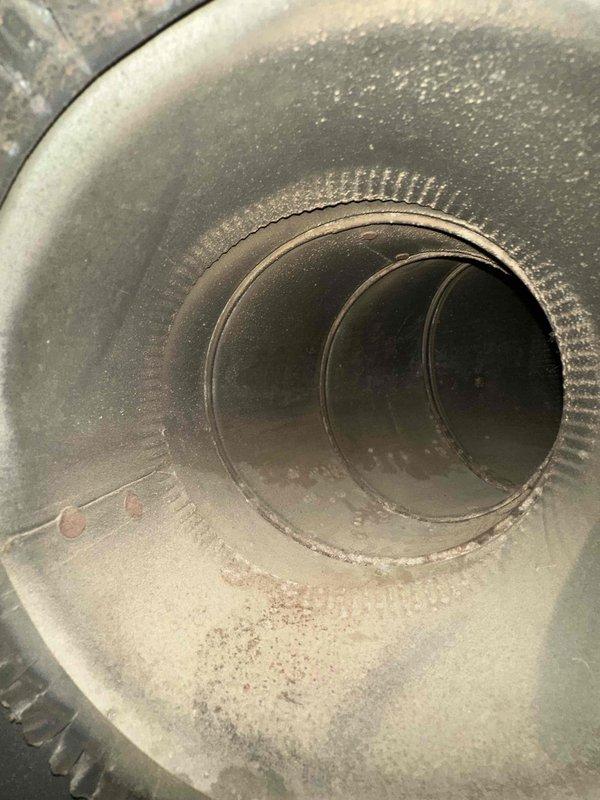 Completed comprehensive duct cleaning service for newly constructed residential property with approximately 14 supply and return vents. Pre-service inspection revealed significant accumulation of construction debris, drywall dust, and particulate matter throughout the ductwork system—common in new home installations. Utilized professional rotary brush system and negative air machine to thoroughly clean all accessible duct runs, including flexible and rigid metal ductwork. Removed heavy deposits of fine dust and debris from duct floors, walls, and interior surfaces, restoring proper airflow capacity and improving indoor air quality for the new homeowners.