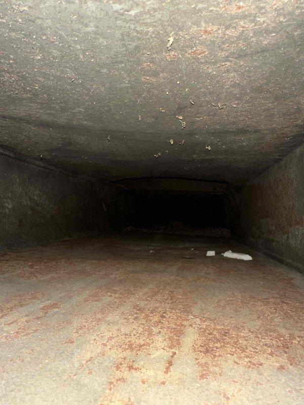 Completed comprehensive duct cleaning service for newly constructed residential property with approximately 14 supply and return vents. Pre-service inspection revealed significant accumulation of construction debris, drywall dust, and particulate matter throughout the ductwork system—common in new home installations. Utilized professional rotary brush system and negative air machine to thoroughly clean all accessible duct runs, including flexible and rigid metal ductwork. Removed heavy deposits of fine dust and debris from duct floors, walls, and interior surfaces, restoring proper airflow capacity and improving indoor air quality for the new homeowners.