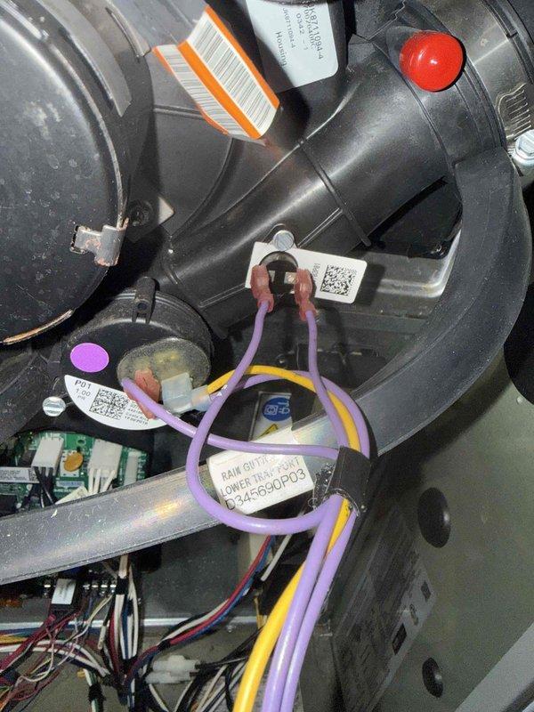 Responded to E32 venting error code on 8-year-old Trane gas furnace. Upon inspection, identified pressure switch issue causing false venting fault. Removed access panel, tested pressure switch and inducer motor operation, cleared debris from pressure tubing, verified proper draft operation, and confirmed system returned to normal heating cycle with error code cleared.