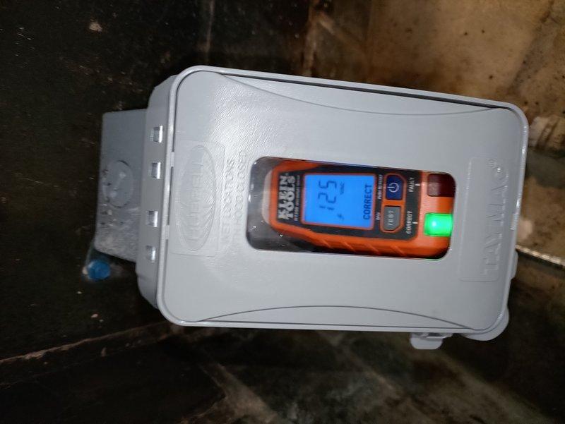 Installed a dedicated 20-amp circuit to power a new 1500-watt electric fireplace unit. Ran romex wiring across the basement through floor joists to the fireplace location, installed a junction box below the fireplace to convert to MC cable, and drilled a penetration to the left of the existing gas line. Fished MC cable up through the existing coal chute, drilled through the brick backing inside the fireplace, and installed a surface-mount receptacle in the rear of the fireplace cavity to provide power for the new electric unit.