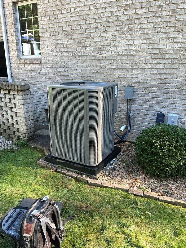 Completed full HVAC system installation at residential property. Installed new outdoor condensing unit on gravel pad with proper clearances from structure, connected electrical service including disconnect box and associated conduit, and verified system operation with temperature differential readings of 114.3°F using calibrated digital instrumentation to confirm proper refrigerant charge and heat transfer performance.