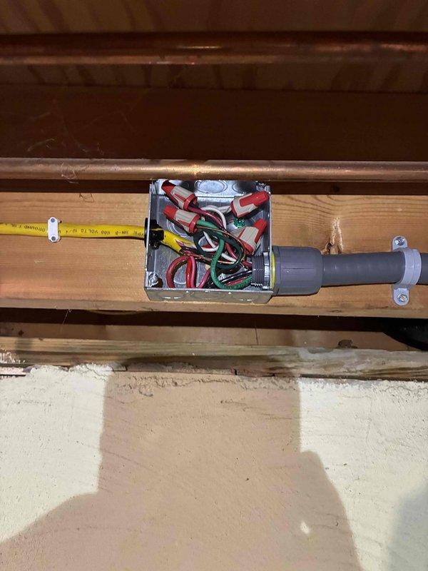 Installed dedicated electrical circuits for AC and furnace systems. Ran new wiring through attic space and mounted junction box on structural beam to facilitate proper wire routing and connections. Installed gray PVC conduit from junction box to electrical panel for code-compliant wire protection. Made all necessary wire terminations using appropriate wire nuts for red, black, green, and yellow conductors within junction box. Extended circuit wiring to main electrical panel and installed new circuit breakers in available positions on bus bars. Connected all hot, neutral, and ground conductors to their respective terminals and grounding bar within panel. Secured all wiring with proper mounting brackets and ensured conduit was firmly attached to structural members. Verified all connections were tight and properly torqued. Tested circuits for proper voltage and confirmed both AC and furnace systems received adequate dedicated power supply per manufacturer specifications and local electric