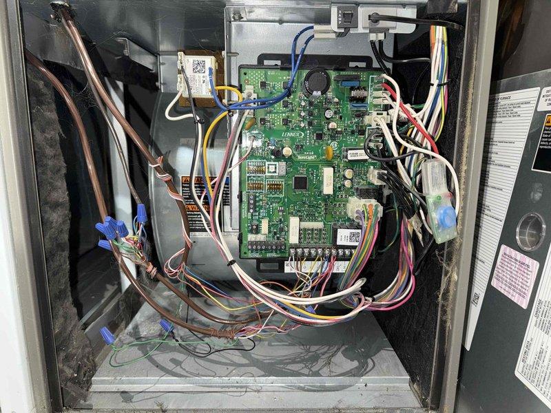 Completed scheduled MVP heating maintenance visit on 9-year-old system. Inspected control board assembly and electrical connections, confirming all components operational. Observed significant dust and debris accumulation on heat exchanger coils requiring attention for optimal system performance and efficiency.