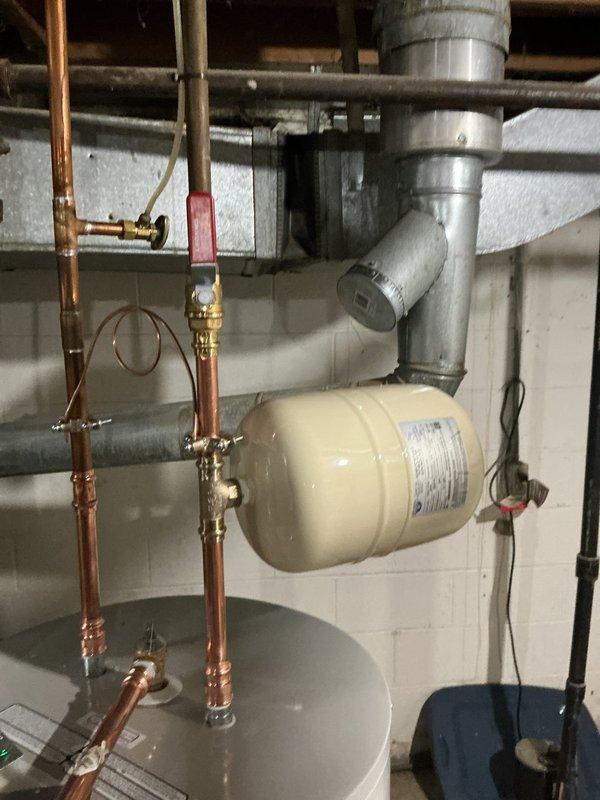 Removed and replaced existing gas water heater with new Bradford White 40-gallon electric water heater. Installed new dedicated electrical circuit to power unit, along with new water shut-off valve, expansion tank, and proper electrical bonding. Abandoned existing gas line and chimney connections per code requirements. Unit includes 6-year tank warranty and was installed with all necessary safety components and accessories.