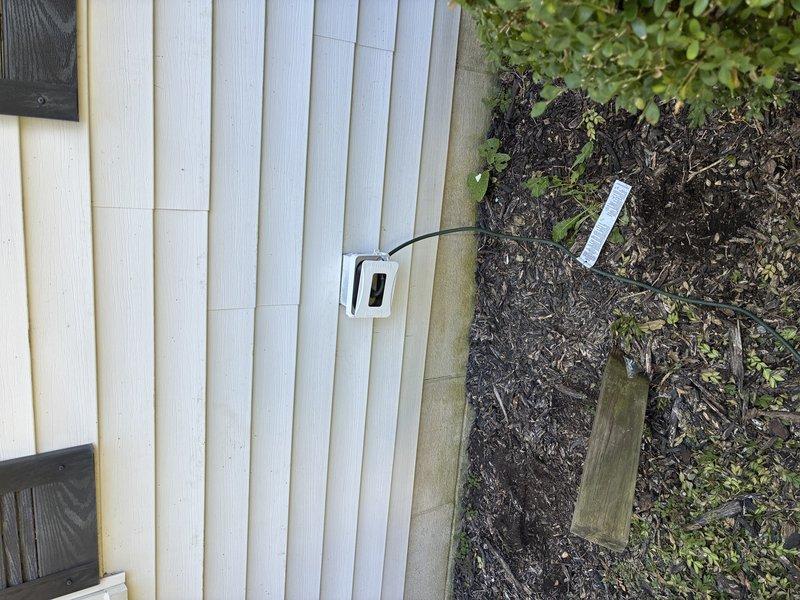 Responded to report of repeatedly tripping basement GFCI outlet feeding downstream circuits and non-functional outdoor outlets. Inspected basement GFCI receptacle mounted on wooden backing near appliance area, noting visible water staining on adjacent wall surfaces indicating potential moisture intrusion. Tested GFCI functionality and load circuits, traced wiring connections to exterior outlet locations. Replaced faulty basement GFCI receptacle with new tamper-resistant unit, verified proper wiring connections and grounding. Confirmed restoration of power to all downstream outlets including exterior receptacles. Advised customer of moisture concerns observed near electrical components and recommended monitoring for future water infiltration issues.