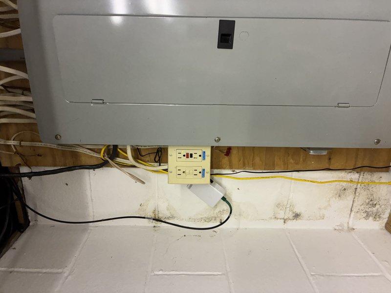Responded to report of repeatedly tripping basement GFCI outlet feeding downstream circuits and non-functional outdoor outlets. Inspected basement GFCI receptacle mounted on wooden backing near appliance area, noting visible water staining on adjacent wall surfaces indicating potential moisture intrusion. Tested GFCI functionality and load circuits, traced wiring connections to exterior outlet locations. Replaced faulty basement GFCI receptacle with new tamper-resistant unit, verified proper wiring connections and grounding. Confirmed restoration of power to all downstream outlets including exterior receptacles. Advised customer of moisture concerns observed near electrical components and recommended monitoring for future water infiltration issues.