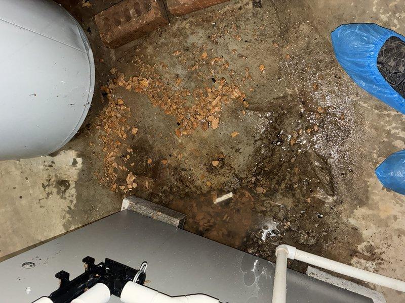 Responded to no-heat call on 2-year-old Lennox furnace with water leaking from base. Upon inspection, found condensate drain line completely blocked, causing water to back up and overflow from furnace. High-efficiency furnace safety controls had shut down unit to prevent damage. Cleared drain line obstruction, verified proper drainage flow through PVC condensate system, tested furnace operation through complete heating cycle, and confirmed unit returned to normal function with no further water accumulation.