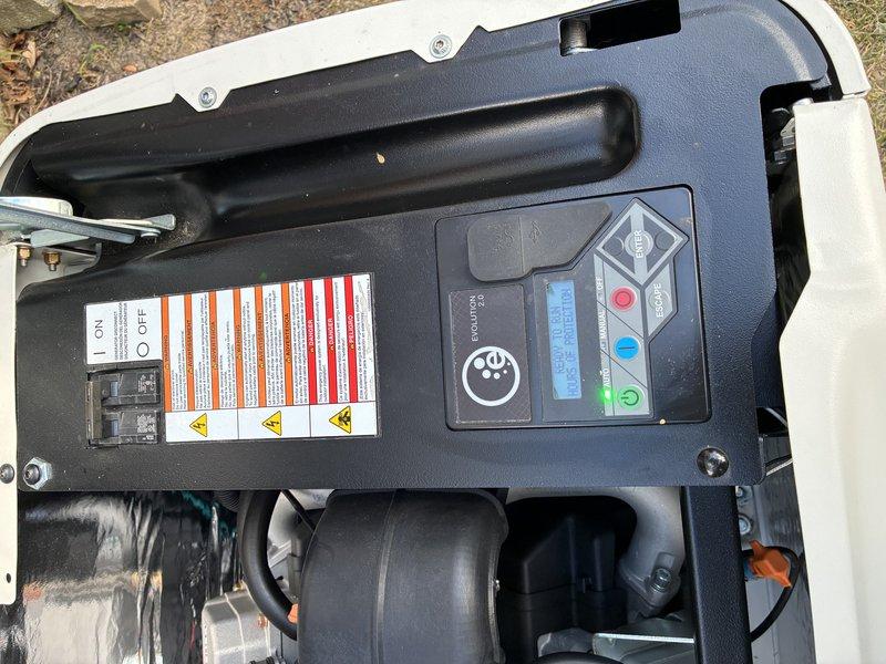 Performed scheduled annual maintenance on one-year-old Generac generator unit as included with original installation. Inspected control panel display and operational indicators, verified all electrical connections and wiring harnesses, examined engine components including ignition system and fuel lines, and confirmed proper mounting and housing integrity. All systems tested and found operating within manufacturer specifications.