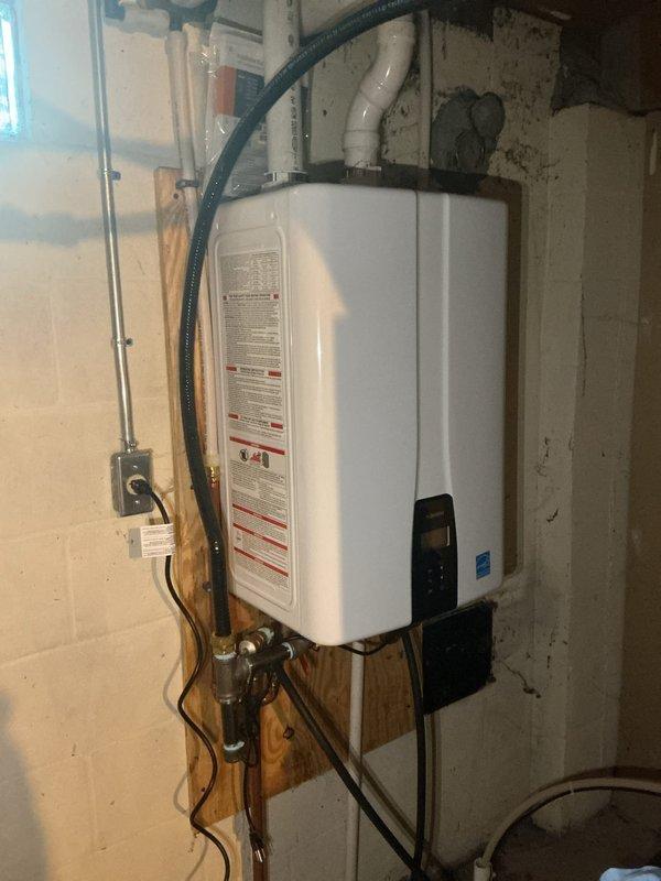 Performed descaling maintenance service on Navien tankless water heater unit. Accessed internal components by removing front panel, flushed heat exchanger assembly with descaling solution to remove mineral buildup and restore optimal heat transfer efficiency. Verified proper operation of pump assembly, electrical connections, and control board functionality upon completion.