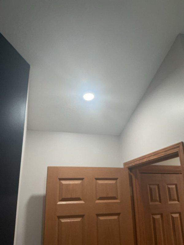 Responded to lightning strike damage affecting multiple light fixtures throughout the residence. Replaced damaged recessed light fixture in bedroom, installed new closet light fixture, and replaced rear deck floodlight. All fixtures tested and verified operational upon completion of installation.