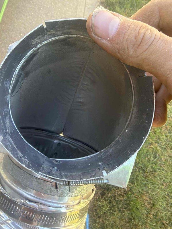 Completed dryer vent cleaning service at residential property. Accessed exterior vent termination point, which showed significant lint and debris accumulation on the vent cover and interior surfaces. Removed deteriorated rubber duct coupling with metal hose clamps from the vent line for replacement. Thoroughly cleaned the entire vent run from interior dryer connection to exterior termination point, removing built-up lint and obstructions to restore proper airflow and reduce fire hazard.