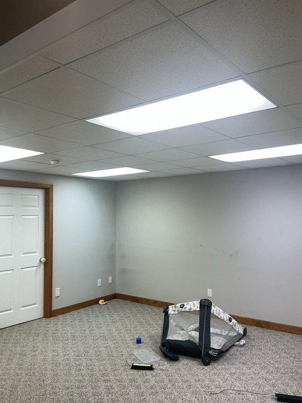 Replaced six fluorescent bulbs in existing fixtures and converted two fluorescent fixtures to ballast bypass configuration, installing eight new LED bulbs compatible with direct-wire operation. Work completed as a follow-up service call after parts were received and staged.