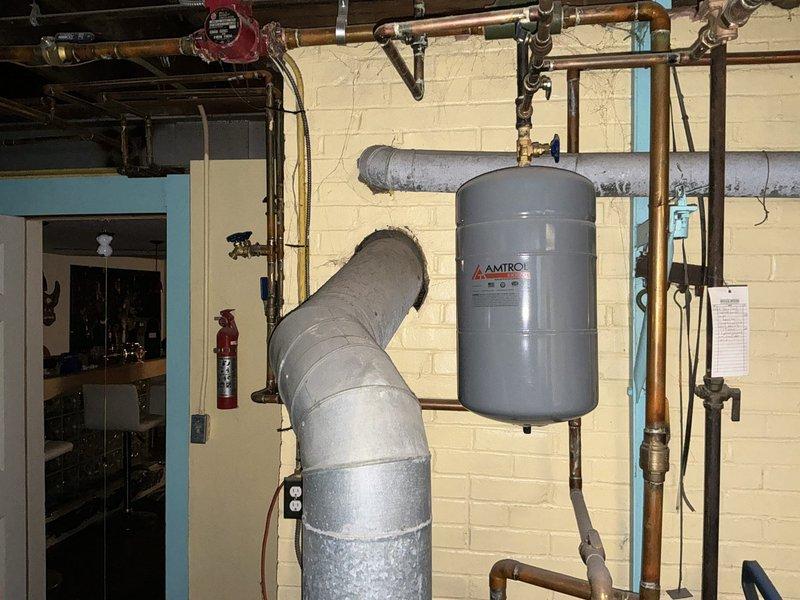 Conducted comprehensive site assessment for boiler and hot water heater replacement estimate. Evaluated existing mechanical room infrastructure including AMTROL expansion tank, copper piping distribution system with multiple shut-off valves and pressure gauges, and PVC drainage network. Documented current equipment configuration, piping layout, and spatial constraints to develop accurate replacement proposal and identify any necessary modifications to existing plumbing and venting systems.