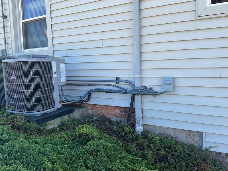 Installed gas line routing for attic-mounted gas furnace installation. Ran black iron pipe from exterior meter location through basement ceiling joists to attic furnace position, ensuring proper support brackets and code-compliant installation throughout run.