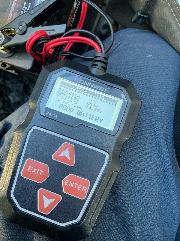 Performed routine generator maintenance on 14kW unit. Conducted battery load test using diagnostic equipment, confirming "GOOD BATTERY" status with all electrical measurements within acceptable parameters. Reset maintenance indicator on Evolution 2.0 controller and verified AUTO mode operation.