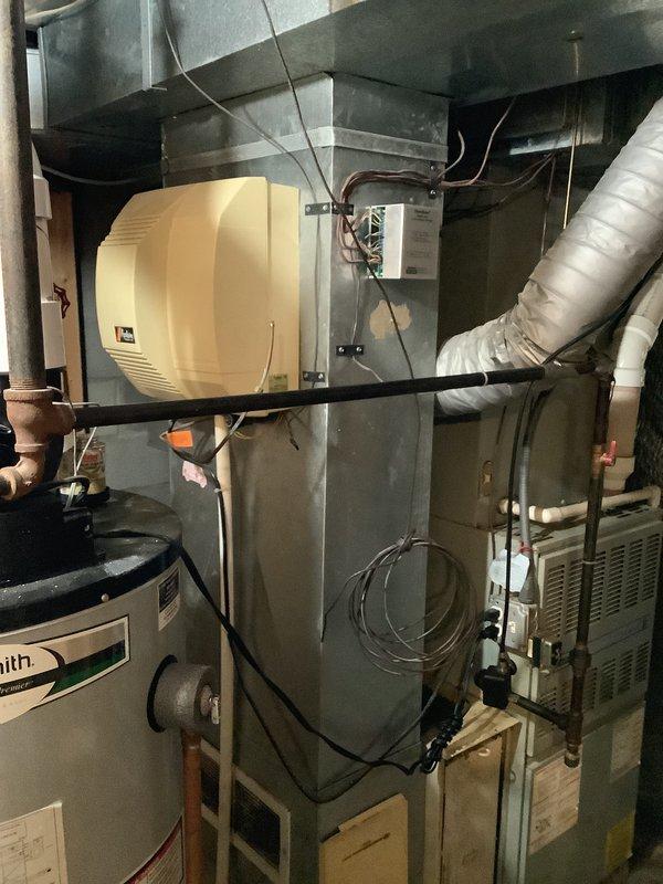 Responded to no heat call and performed comprehensive evaluation of existing Lancaster furnace system in residential basement. Upon inspection, determined unit had reached end of serviceable life and was no longer economically repairable. Documented existing HVAC infrastructure including air handler, humidifier unit, ductwork connections, condensate drainage system, and associated plumbing components. Provided detailed estimate for complete furnace replacement including removal of existing equipment, installation of new high-efficiency heating system, integration with current ductwork and humidifier, proper venting and condensate line connections, and electrical hookups to meet current code requirements.