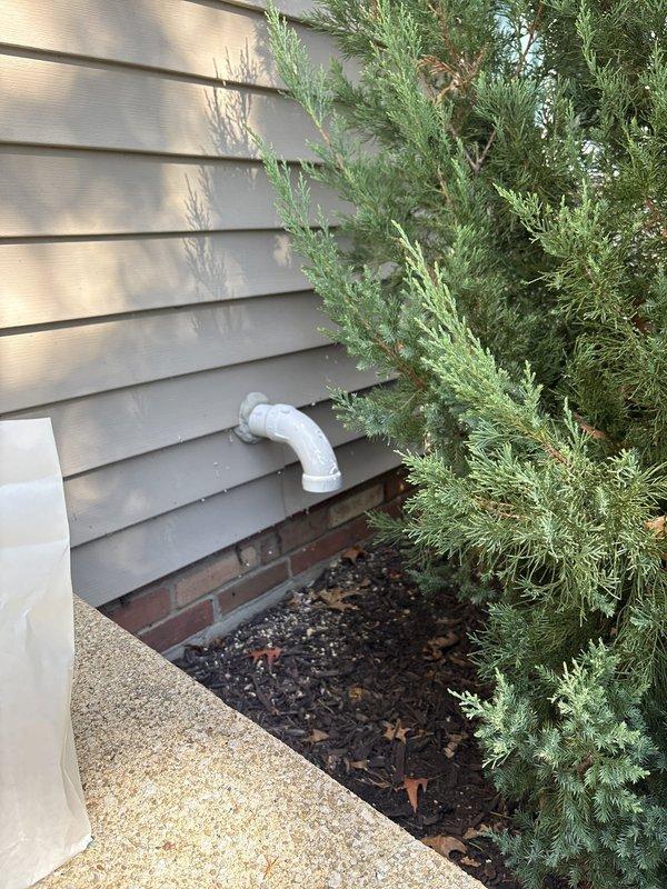 Removed existing tank-style water heater and installed new Navien NPE 240A2 tankless unit in basement location. Ran new gas line, water supply lines, and condensate drain to unit location, and installed surge protector for electrical power connection from nearby breaker box outlet. Configured venting system with exhaust termination on right side of home and fresh air intake routed to front of home exterior, completing all piping connections with appropriate PVC materials as shown in exterior installation.